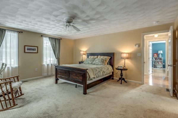 28 Turnpike Road Ipswich, MA 01938 - Photo 13 of 28 a bedroom with a bed and a table in it