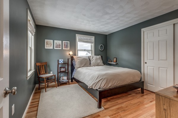 28 Turnpike Road Ipswich, MA 01938 - Photo 18 of 28 a bedroom with a bed wooden floor and window
