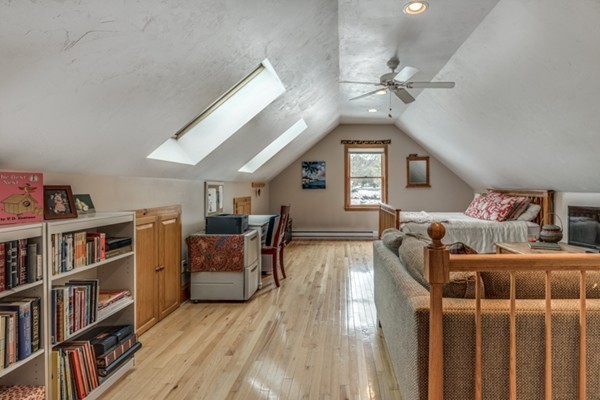 28 Turnpike Road Ipswich, MA 01938 - Photo 20 of 28 a bedroom with furniture and a book shelf