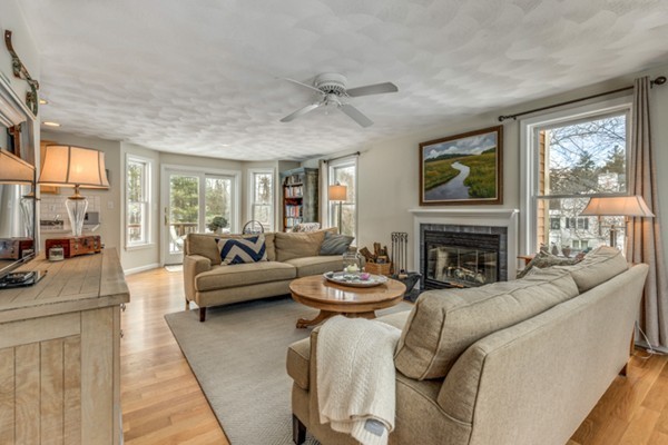28 Turnpike Road Ipswich, MA 01938 - Photo 3 of 28 a living room with furniture a large window and a fireplace
