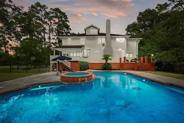 swimming pool view with a outdoor seating