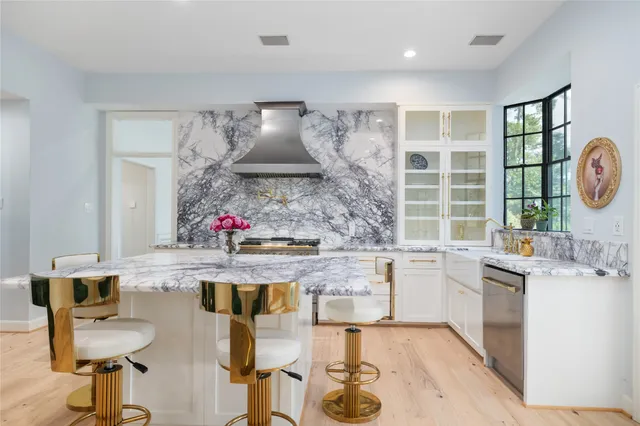 a kitchen with a sink and a stove