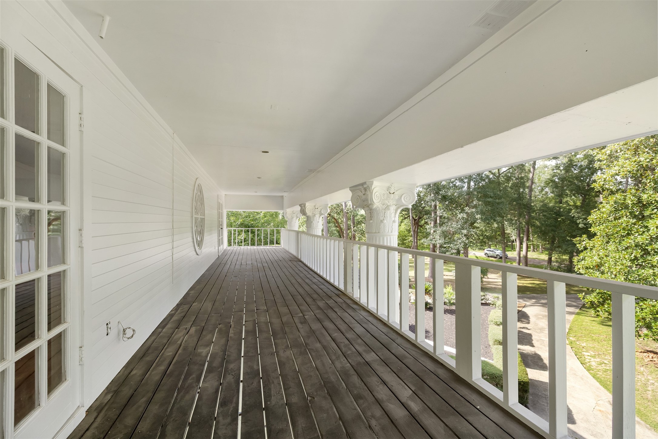 17003 Creeksouth Road Houston, TX 77068 - Photo 30 of 49 Step out onto this expansive second-story balcony—a perfect spot to savor morning coffee, unwind with a good book, or enjoy peaceful evenings watching the sunset. This serene outdoor space invites you to embrace fresh air and tranquil views, adding an elegant extension to everyday living.