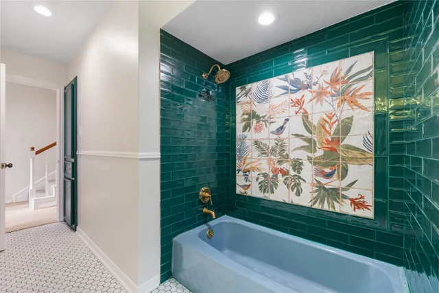 a bathroom with a bathtub and shower