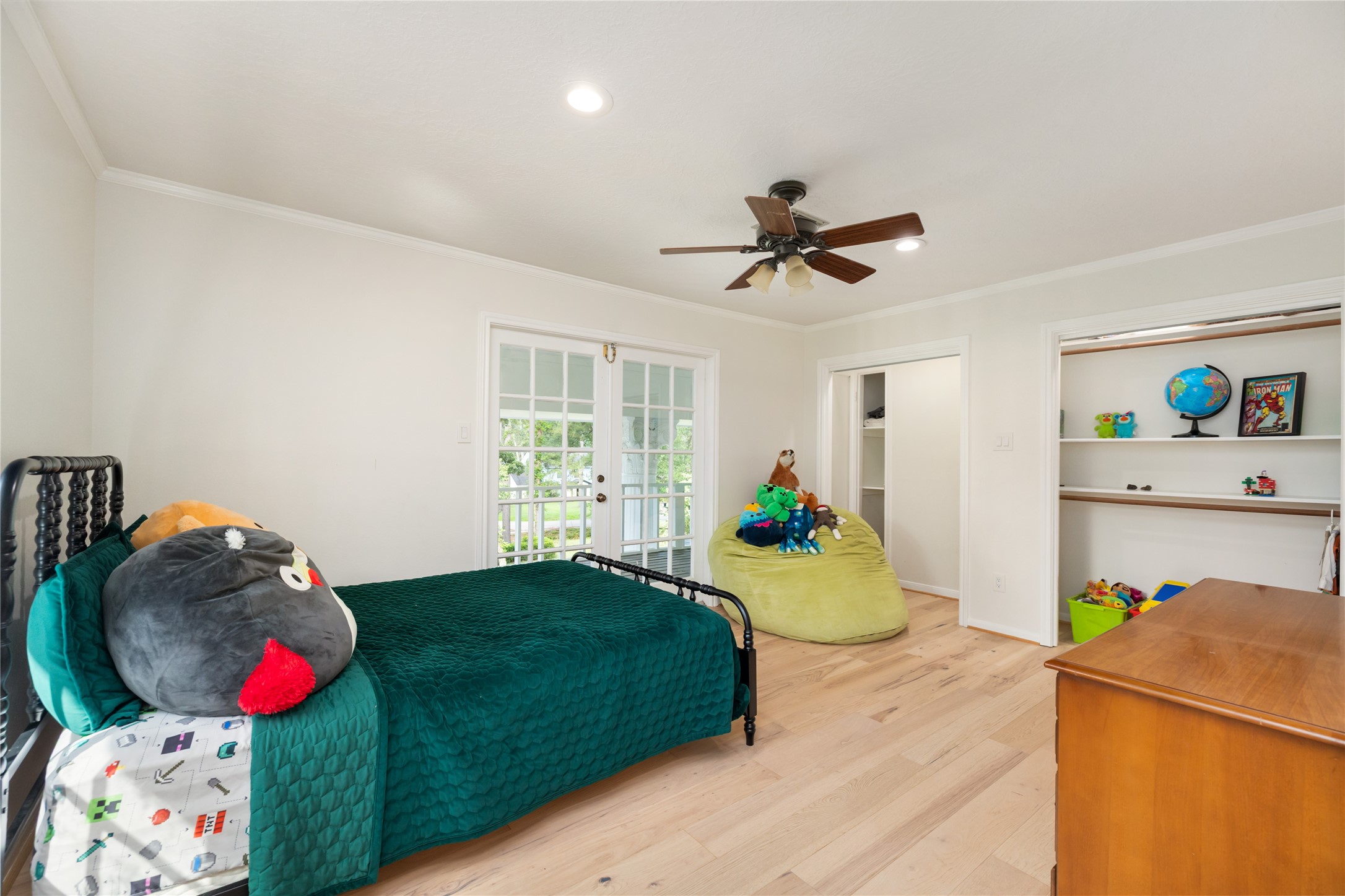 17003 Creeksouth Road Houston, TX 77068 - Photo 35 of 49 This spacious secondary bedroom features a large closet and beautiful French doors that open to the upper balcony—bringing in natural light and offering a seamless connection to the outdoors.