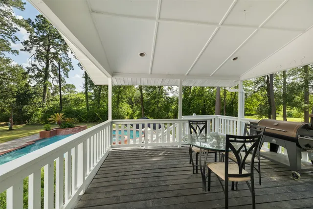 a view of a chairs and table in the balcony