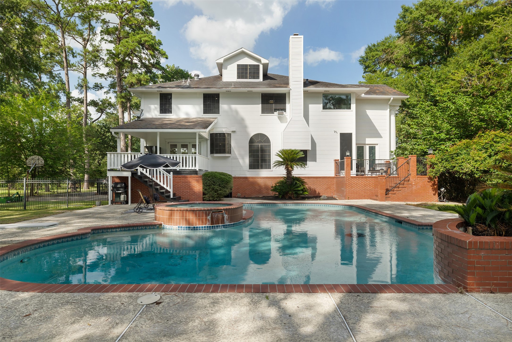 17003 Creeksouth Road Houston, TX 77068 - Photo 41 of 49 Whether you’re hosting lively gatherings, sharing quiet moments by the pool, or simply soaking in the peaceful surroundings, every detail invites you to embrace a lifestyle of comfort and serenity.