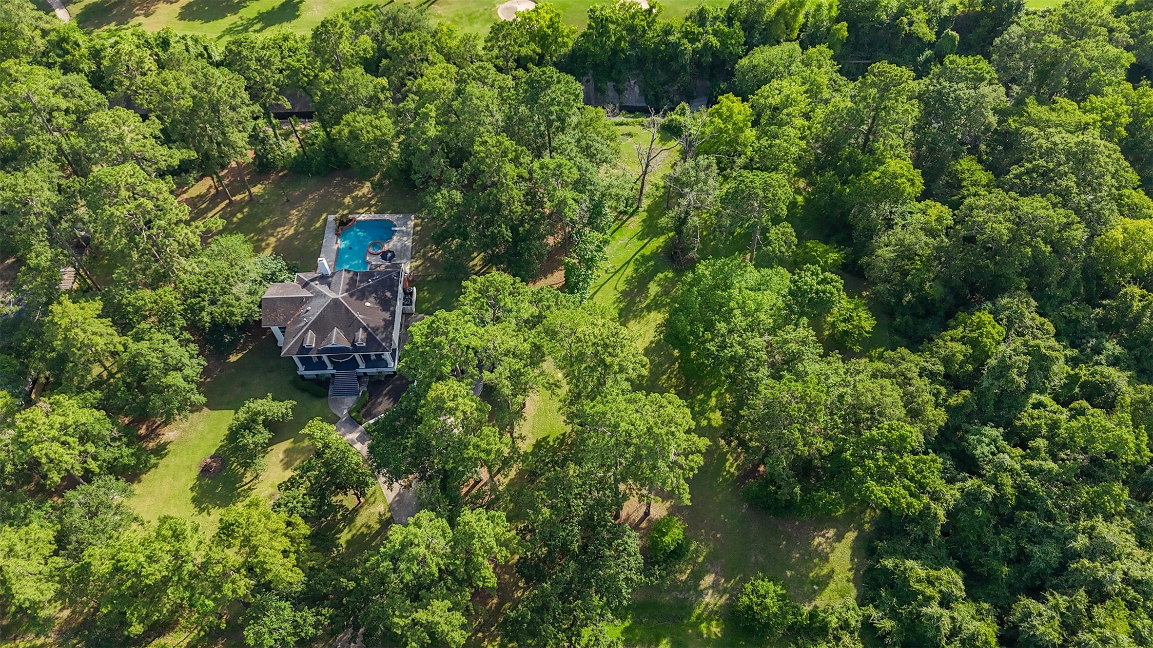 17003 Creeksouth Road Houston, TX 77068 - Photo 45 of 49 Live peacefully beneath the canopy of mature trees on this meticulously landscaped estate!