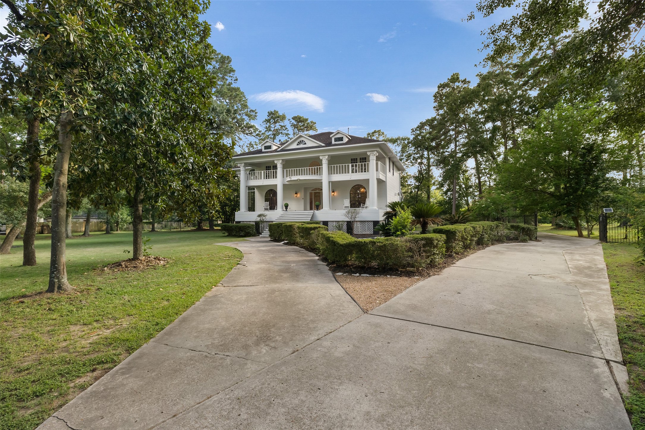 17003 Creeksouth Road Houston, TX 77068 - Photo 8 of 49 A graceful arrival begins here—an extended driveway leads discreetly to the side of the home for private parking, while a charming front walkway guides guests to the grand entry steps.