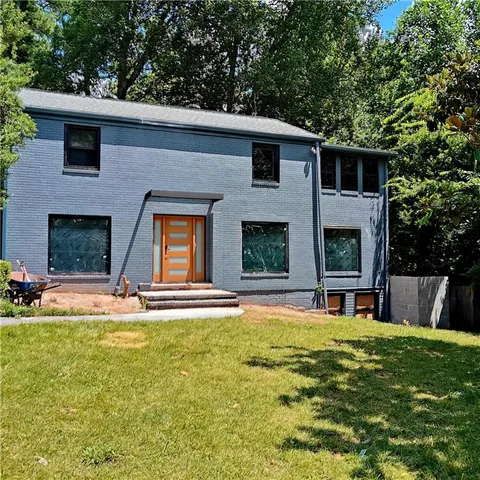 a swimming pool with outdoor seating and yard