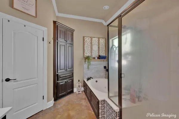 a bathroom with a bathtub and a shower