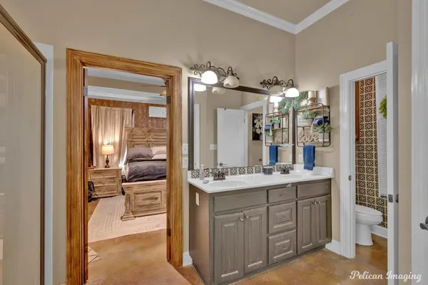 a bathroom with a sink vanity granite and a mirror
