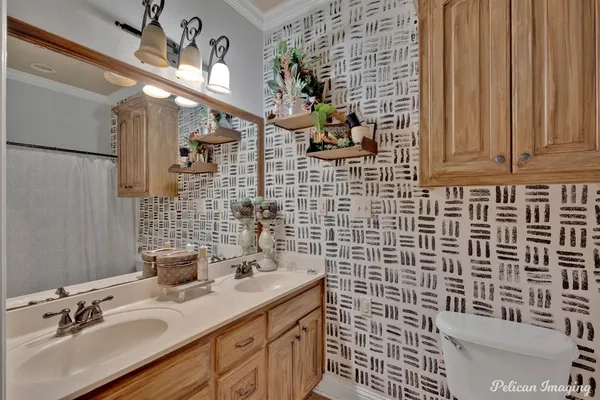 a bathroom with a sink a mirror and shower