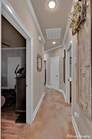 a view of a hallway with closet and entryway
