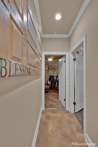 a view of a hallway with a livingroom and a stairs