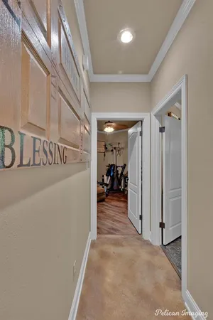 a view of a hallway with a livingroom and a stairs