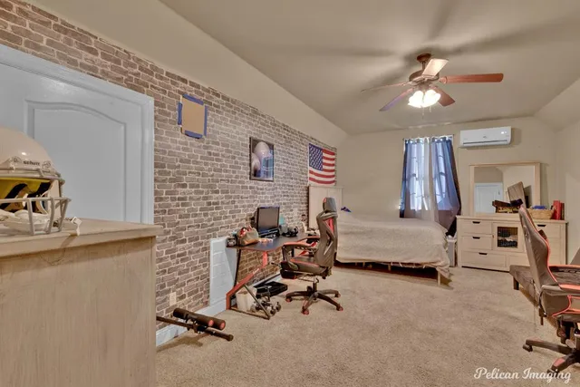 a view of a livingroom with workspace and a couch