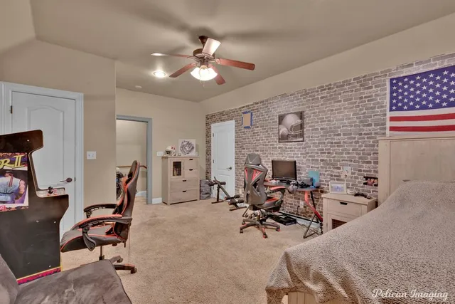 a view of a livingroom with furniture and a workspace