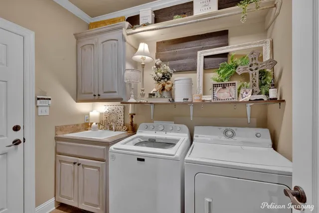 a utility room with closet dryer and washer