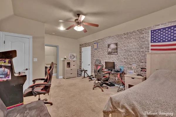 a view of a livingroom with furniture and a workspace