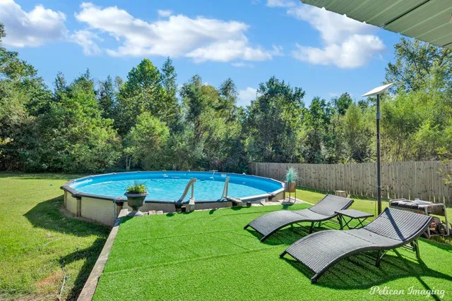 a view of a two chairs in a patio