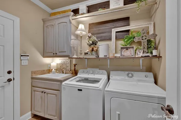 a utility room with closet dryer and washer