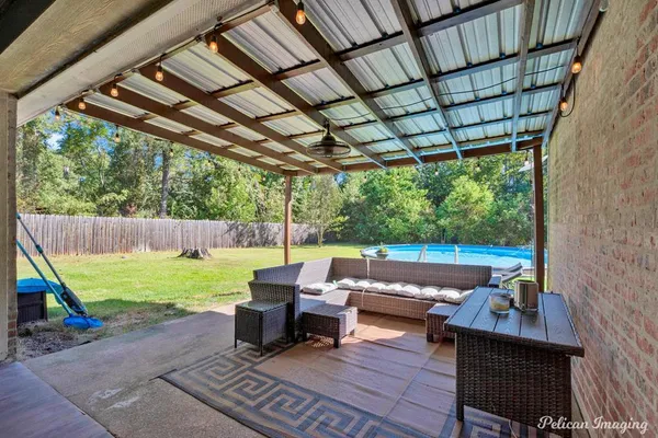 a backyard of a house with outdoor seating