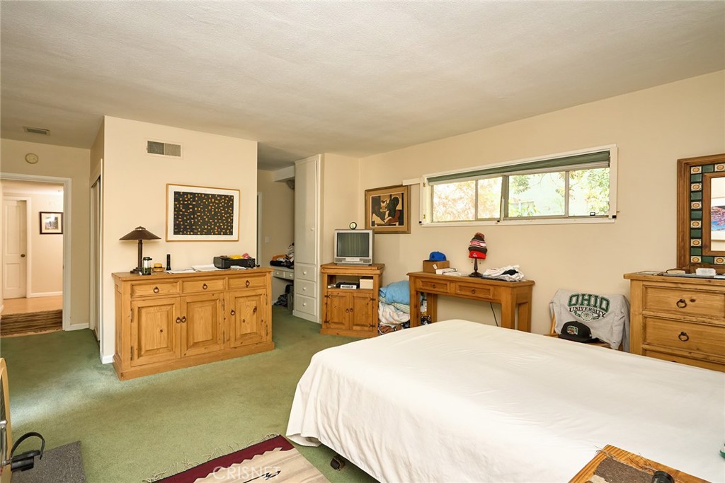 10370 Topeka Drive Porter Ranch, CA 91326 - Photo 12 of 33 a bed room with two bed and a television