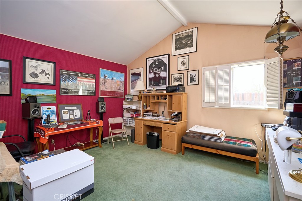 10370 Topeka Drive Porter Ranch, CA 91326 - Photo 13 of 33 a room with furniture and a window