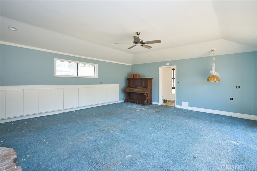 10370 Topeka Drive Porter Ranch, CA 91326 - Photo 22 of 33 a view of empty room with a ceiling fan
