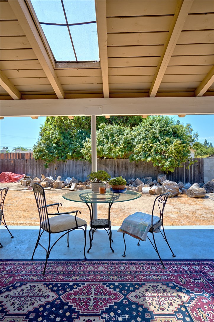 10370 Topeka Drive Porter Ranch, CA 91326 - Photo 23 of 33 a view of a swimming pool with chairs and wooden fence