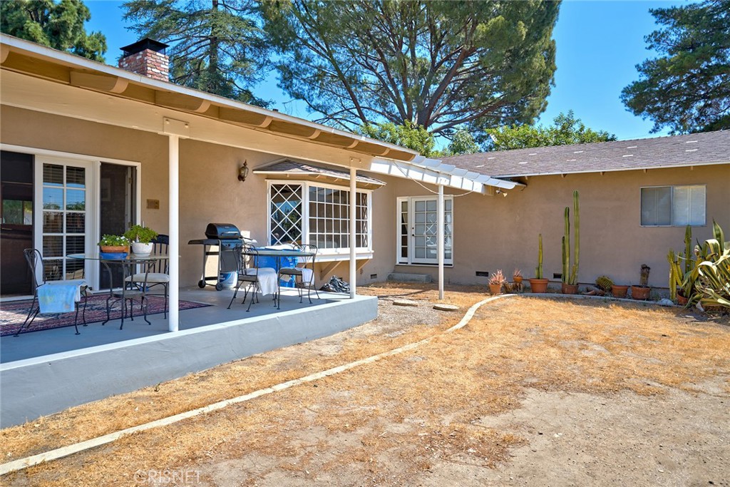10370 Topeka Drive Porter Ranch, CA 91326 - Photo 26 of 33 a swimming pool with outdoor seating and yard