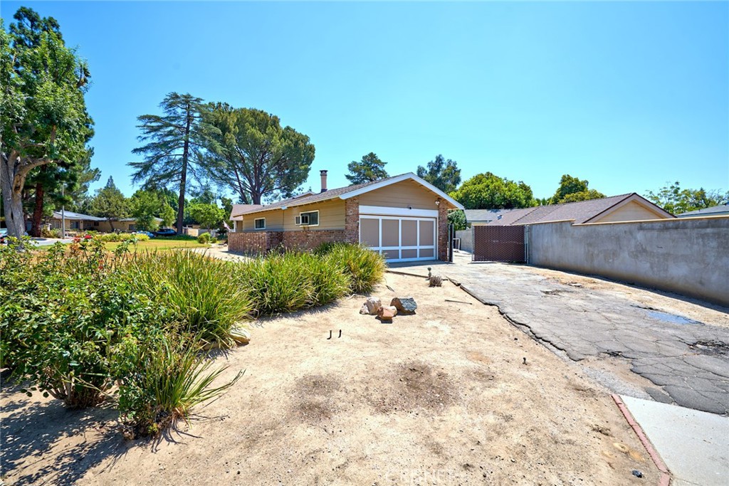 10370 Topeka Drive Porter Ranch, CA 91326 - Photo 31 of 33 a front view of a house with a yard