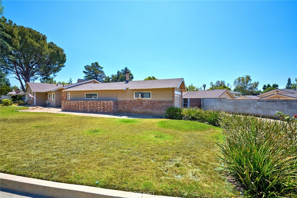 10370 Topeka Drive Porter Ranch, CA 91326 - Photo 32 of 33 a view of a big yard with a large tree