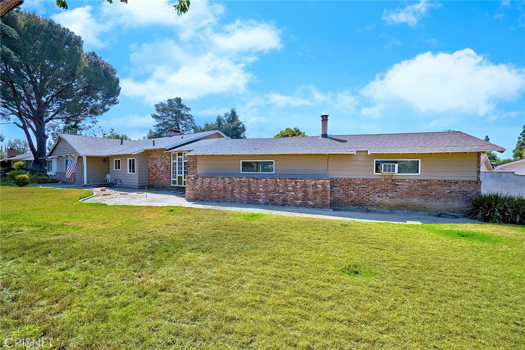 10370 Topeka Drive Porter Ranch, CA 91326 - Photo 4 of 33 a front view of a house with swimming pool having outdoor seating