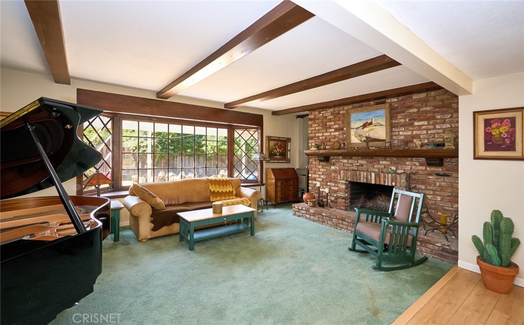 10370 Topeka Drive Porter Ranch, CA 91326 - Photo 6 of 33 a living room with furniture and a fireplace
