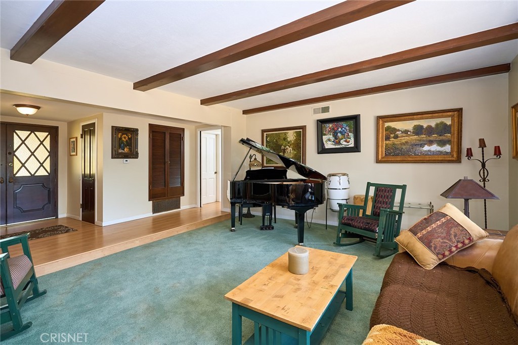 10370 Topeka Drive Porter Ranch, CA 91326 - Photo 8 of 33 a living room with furniture and a piano