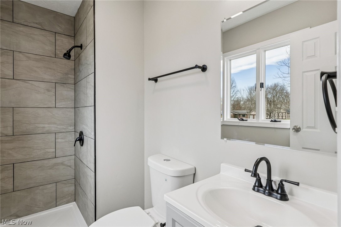 2829 Tibbetts Wick Road Hubbard, OH 44425 - Photo 15 of 44 Bathroom featuring vanity and a shower stall