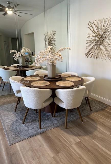 15865 Southwest 6th Place, Unit 201 Pembroke Pines, FL 33027 - Photo 13 of 80 a view of a dining room with furniture and wooden floor