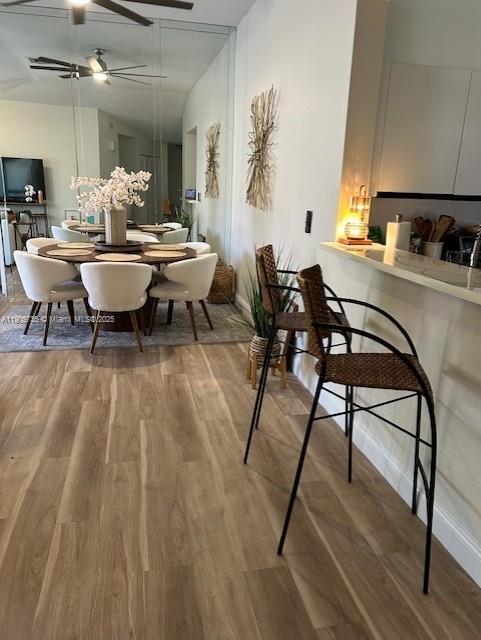 15865 Southwest 6th Place, Unit 201 Pembroke Pines, FL 33027 - Photo 15 of 80 a dining room with furniture and wooden floor