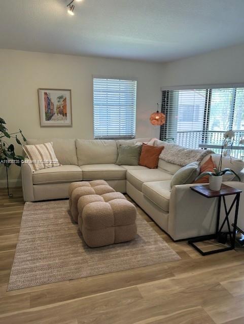 15865 Southwest 6th Place, Unit 201 Pembroke Pines, FL 33027 - Photo 16 of 80 a living room with furniture and a large window