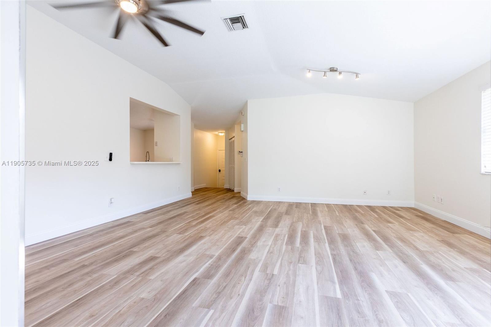 15865 Southwest 6th Place, Unit 201 Pembroke Pines, FL 33027 - Photo 18 of 80 wooden floor in an empty room