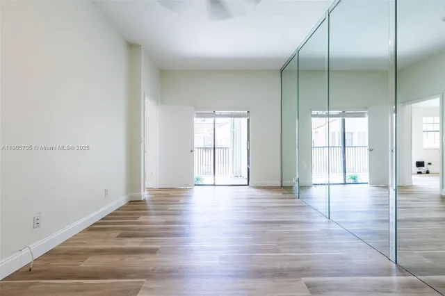 an aerial view of residential houses with outdoor space and river
