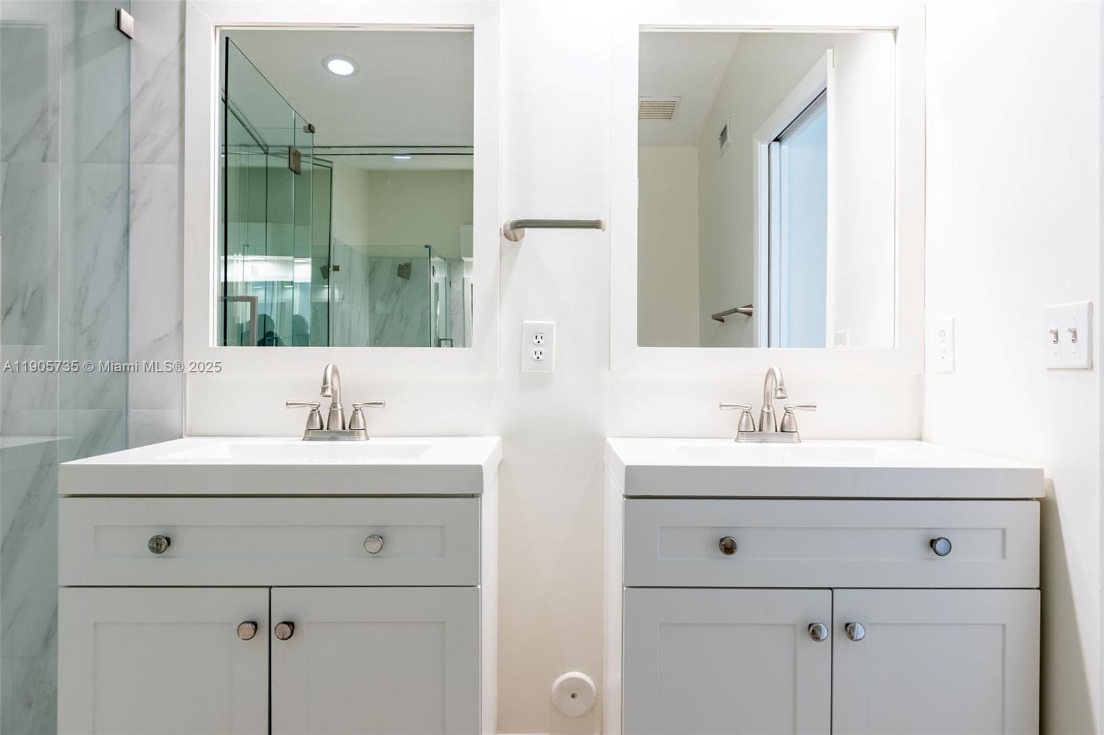 15865 Southwest 6th Place, Unit 201 Pembroke Pines, FL 33027 - Photo 27 of 80 a bathroom with double sink and two mirror