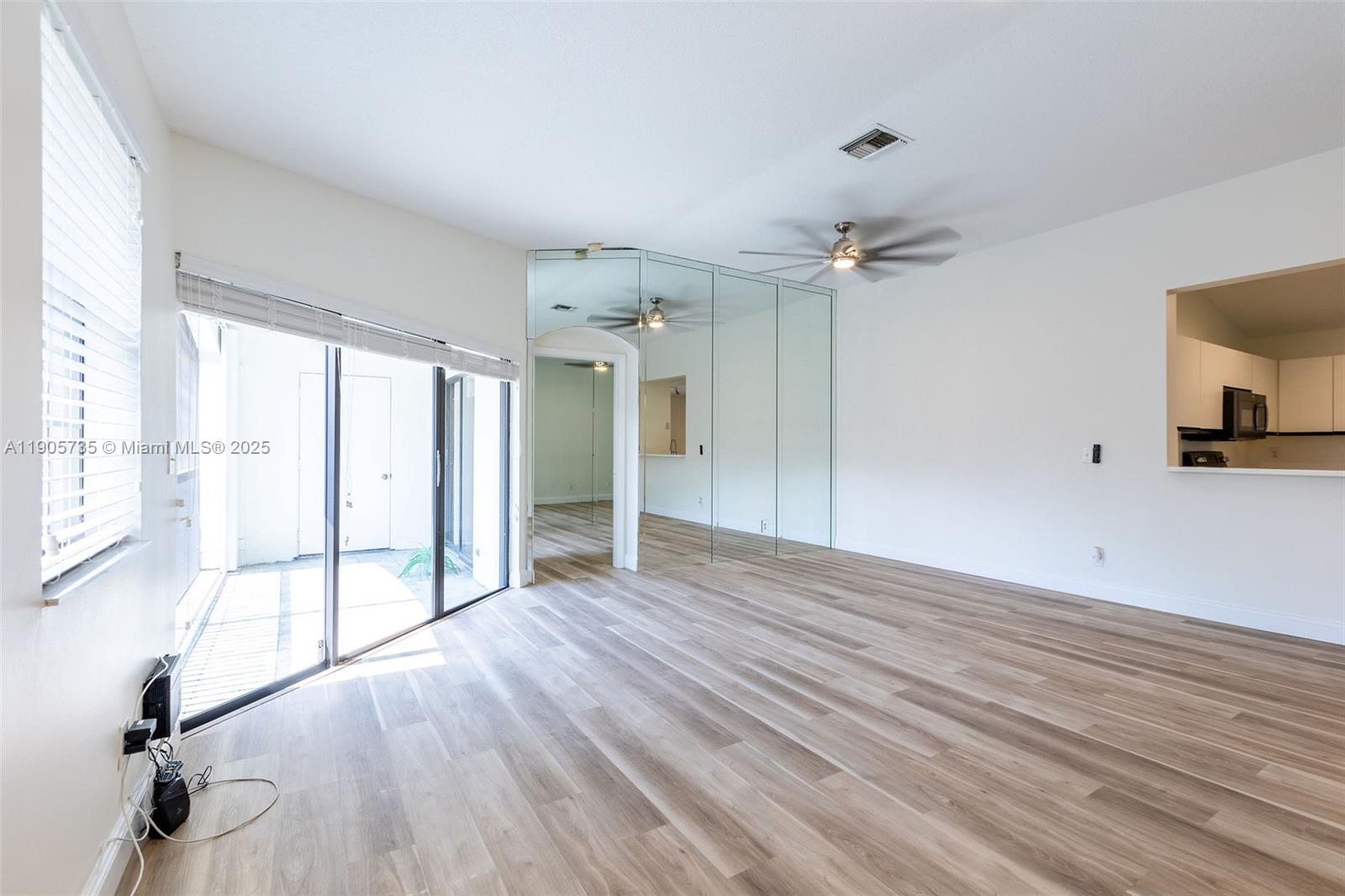 15865 Southwest 6th Place, Unit 201 Pembroke Pines, FL 33027 - Photo 3 of 80 a view of an empty room with a window
