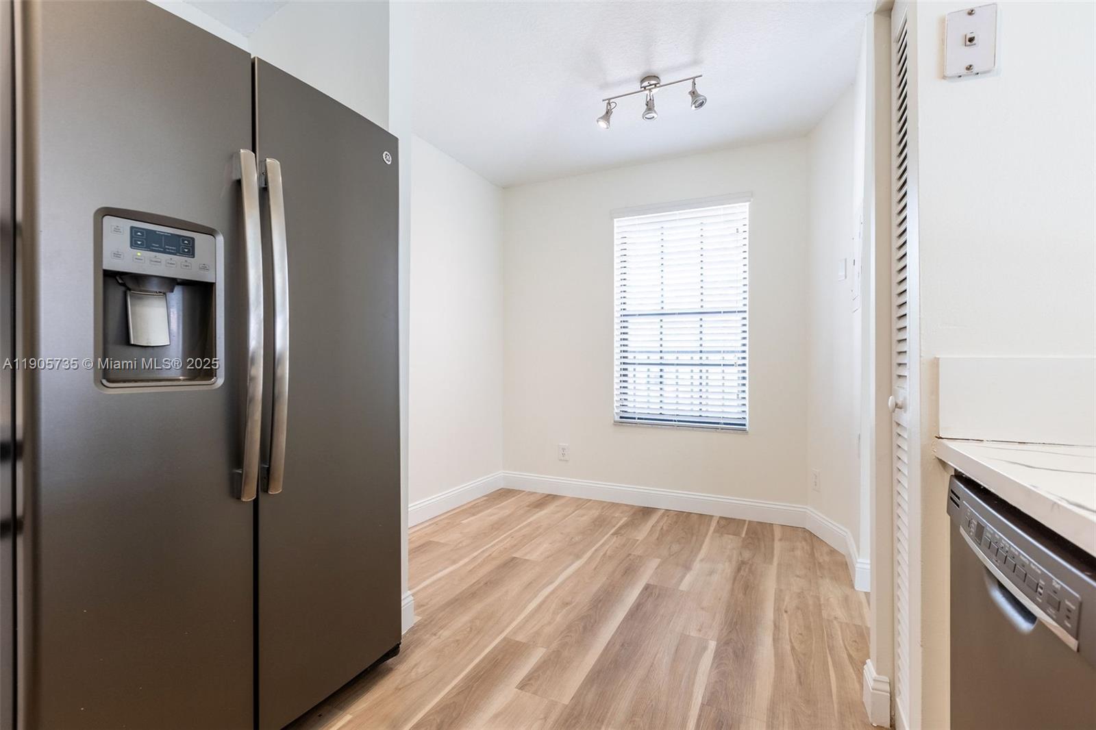 15865 Southwest 6th Place, Unit 201 Pembroke Pines, FL 33027 - Photo 34 of 80 a view of a kitchen from a hallway