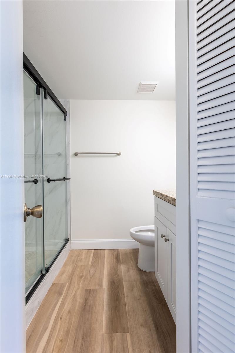 15865 Southwest 6th Place, Unit 201 Pembroke Pines, FL 33027 - Photo 38 of 80 a bathroom with a toilet and a shower