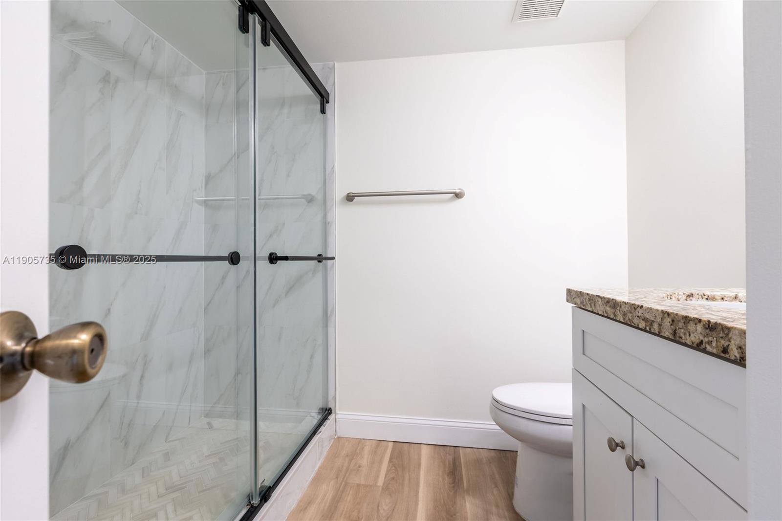 15865 Southwest 6th Place, Unit 201 Pembroke Pines, FL 33027 - Photo 40 of 80 a bathroom with a toilet and a shower