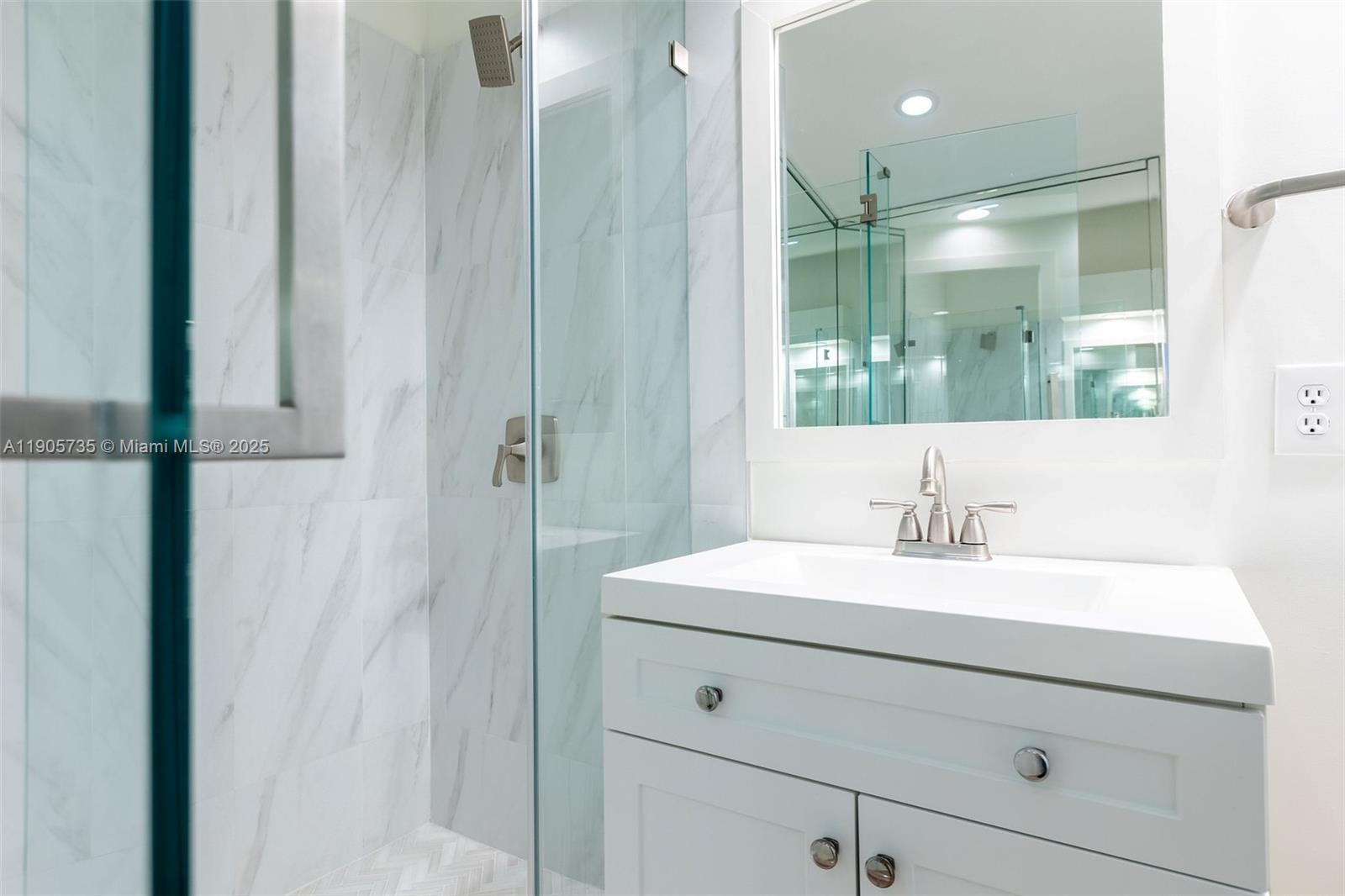 15865 Southwest 6th Place, Unit 201 Pembroke Pines, FL 33027 - Photo 42 of 80 a bathroom with a sink and a mirror