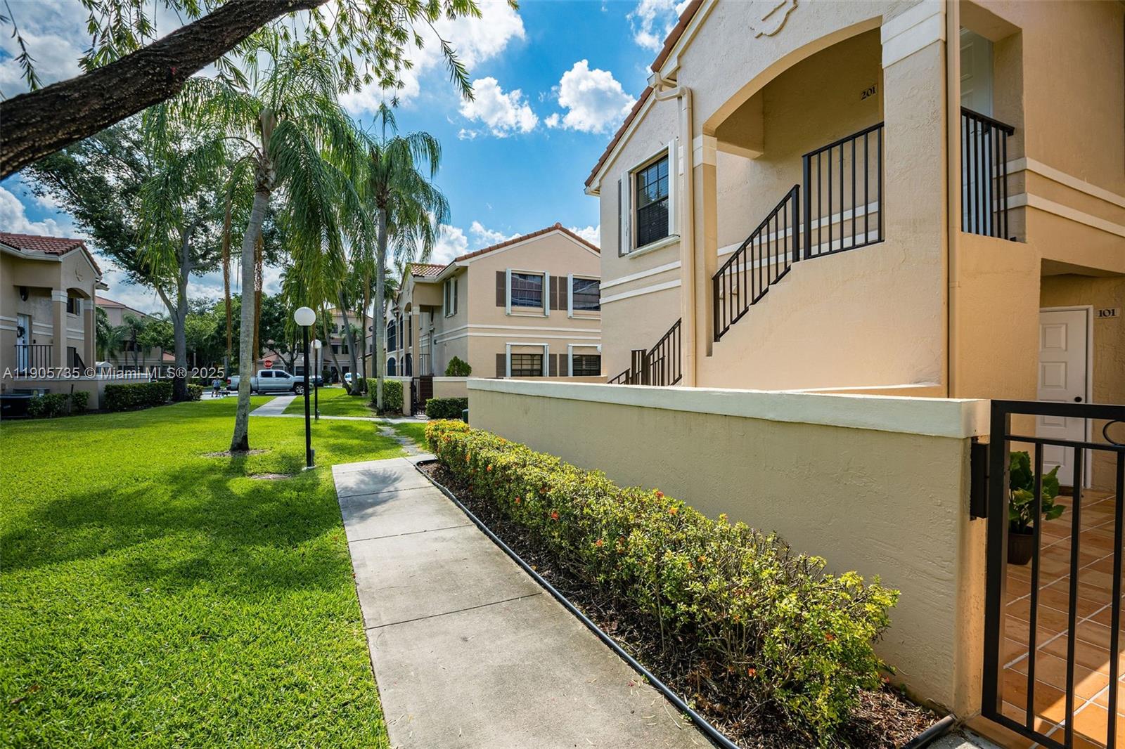 15865 Southwest 6th Place, Unit 201 Pembroke Pines, FL 33027 - Photo 49 of 80 a view of a house with a yard